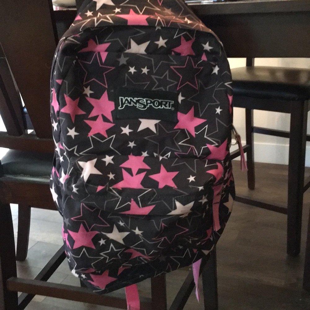 Jansport black stars and pink stars backpack